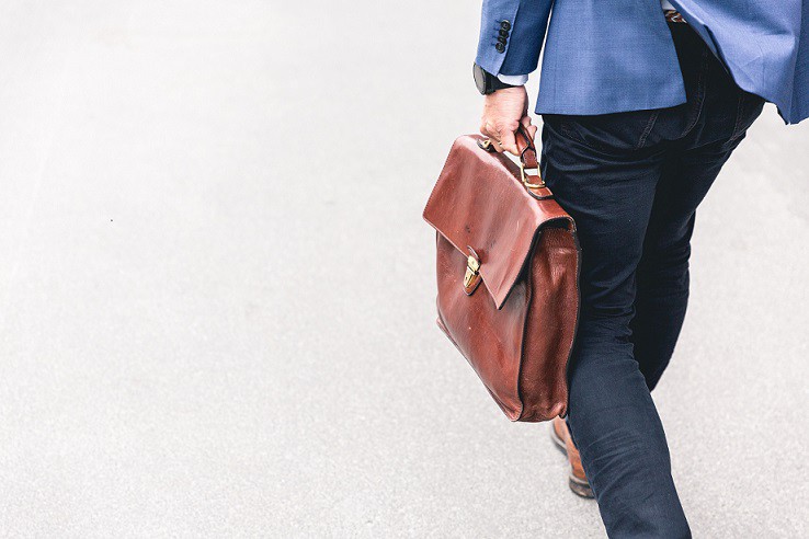 business man walking with brief case