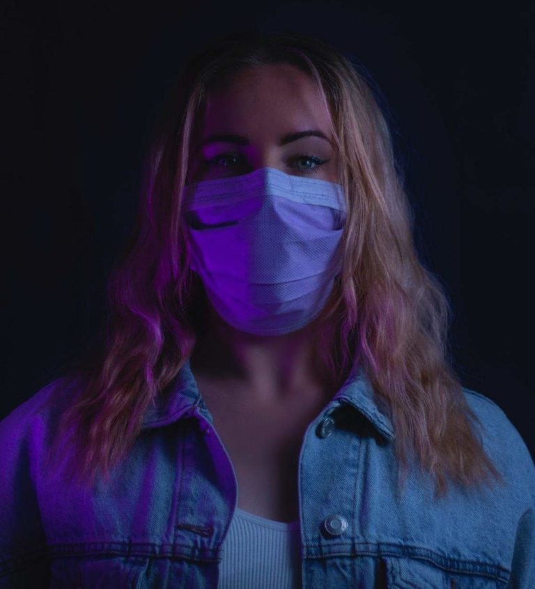 blonde woman wearing a face mask