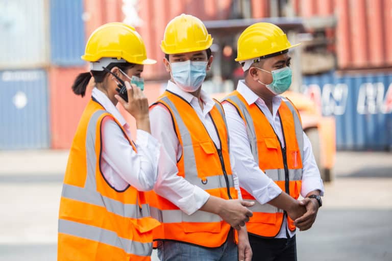 group of construction worker wearing protective mask