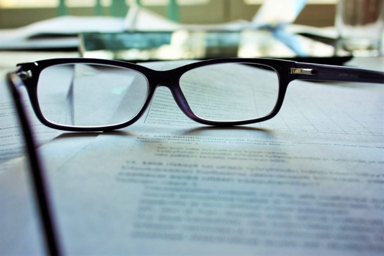 A pair of glasses resting on top of a legal document.